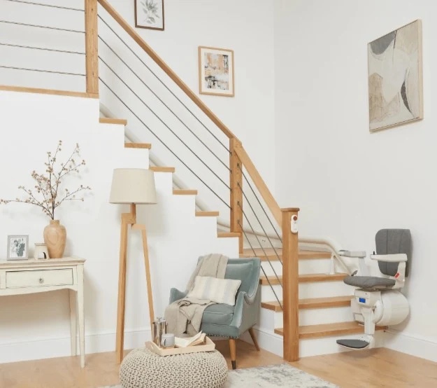 Modern stair lift on a wooden staircase